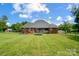 Vast, well-manicured backyard with a trampoline, a playground, and a spacious lawn for outdoor enjoyment at 3011 Patrick Place Cir, Clover, SC 29710