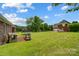 Large backyard featuring a playground, trampoline, and plenty of open space for Gathering activities at 3011 Patrick Place Cir, Clover, SC 29710