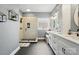 Modern bathroom with a glass enclosed shower and dual sinks with white cabinetry at 3011 Patrick Place Cir, Clover, SC 29710