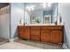 Bathroom featuring double sink vanity with wood cabinets and a large mirror at 3011 Patrick Place Cir, Clover, SC 29710