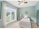 Bright bedroom with a large window, a ceiling fan, and cozy decor at 3011 Patrick Place Cir, Clover, SC 29710