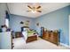 Comfortable blue bedroom with ceiling fan, toys, and a cozy atmosphere at 3011 Patrick Place Cir, Clover, SC 29710
