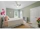 Cozy bedroom features a ceiling fan, natural light, and soft, neutral colors at 3011 Patrick Place Cir, Clover, SC 29710