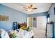 Comfortable blue bedroom with ceiling fan, toys, and a cozy atmosphere at 3011 Patrick Place Cir, Clover, SC 29710