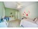 Bright and airy bedroom with a ceiling fan, two windows, and a comfortable bed at 3011 Patrick Place Cir, Clover, SC 29710
