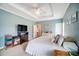 Primary bedroom features a ceiling fan, soft carpet, and two large windows at 3011 Patrick Place Cir, Clover, SC 29710