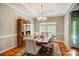 Spacious dining room with elegant furniture, a large window, and hardwood flooring at 3011 Patrick Place Cir, Clover, SC 29710