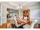 Elegant dining room featuring hardwood floors and an open connection to the living area at 3011 Patrick Place Cir, Clover, SC 29710