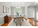 Elegant dining room with a chandelier, a large window, and ample seating for entertaining at 3011 Patrick Place Cir, Clover, SC 29710