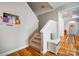Inviting entryway featuring a staircase and bench with hardwood floors leading to other rooms at 3011 Patrick Place Cir, Clover, SC 29710