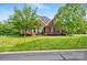 Charming brick home featuring a well-manicured lawn and mature trees in a desirable neighborhood at 3011 Patrick Place Cir, Clover, SC 29710