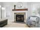 Close-up of a fireplace with stone surround, wooden mantel, and decorative accents at 3011 Patrick Place Cir, Clover, SC 29710