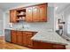 Kitchen showcasing wood cabinets, granite countertops, stainless steel appliances, with access to living space at 3011 Patrick Place Cir, Clover, SC 29710