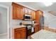 Kitchen showcases granite countertops, stainless steel appliances, and wood cabinets, complementing the hardwood floors at 3011 Patrick Place Cir, Clover, SC 29710
