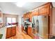 Bright kitchen featuring stainless steel appliances, granite countertops, and hardwood floors at 3011 Patrick Place Cir, Clover, SC 29710