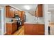 Kitchen featuring granite countertops, wood cabinets, stainless steel appliances, and hardwood floors at 3011 Patrick Place Cir, Clover, SC 29710
