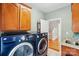 Functional laundry room with modern appliances and convenient access to hallway stairs at 3011 Patrick Place Cir, Clover, SC 29710