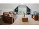 Comfortable living room with large window, built-in shelves, and a plush brown sofa at 3011 Patrick Place Cir, Clover, SC 29710
