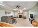 Cozy living room with tray ceilings, a fireplace, neutral colors and large sectional for relaxation and entertaining at 3011 Patrick Place Cir, Clover, SC 29710