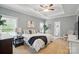 Spacious bedroom with trey ceilings, plush carpet, with an ensuite bathroom and a sitting area at 3011 Patrick Place Cir, Clover, SC 29710