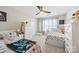 Bright bedroom with two beds, ceiling fan and ample closet space at 3095 Foggy Hollow Ln, Clover, SC 29710