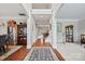 Inviting foyer with hardwood floors, leading to dining and living areas; showcasing a bright, open layout at 3095 Foggy Hollow Ln, Clover, SC 29710
