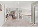 Open hallway with neutral carpet, wooden railings, and access to various rooms at 3095 Foggy Hollow Ln, Clover, SC 29710