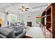 Bright and spacious living room featuring a fireplace, coffered ceilings, and access to the outdoor deck at 3095 Foggy Hollow Ln, Clover, SC 29710
