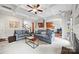 Open-concept living room with hardwood floors, access to a breakfast nook, and a staircase at 3095 Foggy Hollow Ln, Clover, SC 29710