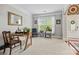 Bright living room featuring a desk area with ample natural light, neutral walls, and carpeted flooring at 3095 Foggy Hollow Ln, Clover, SC 29710
