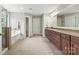 Spacious bathroom with tiled floors, dual vanity, and walk-in shower with separate tub at 3095 Foggy Hollow Ln, Clover, SC 29710