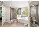 Bright bathroom with tile floor featuring a shower, tub, and toilet at 3095 Foggy Hollow Ln, Clover, SC 29710