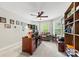 Cozy home office featuring a ceiling fan, a comfortable seating area, and a large wooden desk at 3095 Foggy Hollow Ln, Clover, SC 29710