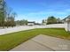Fenced backyard has a concrete patio and lush green lawn at 4147 Timberwood Dr, Gastonia, NC 28056