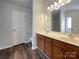 Bathroom boasts a double sink vanity with storage and a large mirror at 4147 Timberwood Dr, Gastonia, NC 28056