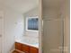 Bathroom featuring a large tub with jets and shower with glass enclosure at 4147 Timberwood Dr, Gastonia, NC 28056