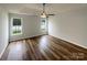 Spacious bedroom features wood-look flooring, a ceiling fan, and tray ceiling at 4147 Timberwood Dr, Gastonia, NC 28056