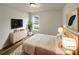 Virtually staged bedroom featuring modern furniture, a large window, and neutral decor to show off the spacious layout at 4147 Timberwood Dr, Gastonia, NC 28056