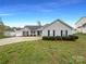 Charming single-story home featuring well-maintained landscaping and inviting curb appeal with grey siding at 4147 Timberwood Dr, Gastonia, NC 28056