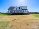 Expansive backyard shows the home, deck, and perimeter fencing at 4189 Brandy Creek Ct, Clover, SC 29710