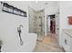 Bright bathroom featuring a freestanding tub, glass shower, and an open closet at 4189 Brandy Creek Ct, Clover, SC 29710