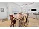 Dining area with a wooden table, decor, and open views into the living area and kitchen at 4189 Brandy Creek Ct, Clover, SC 29710