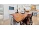 Cozy dining room with a wooden table and views of the modern kitchen with white cabinets at 4189 Brandy Creek Ct, Clover, SC 29710