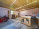Well-lit garage with workbench and room for equipment, ideal for hobbyists and DIY enthusiasts at 4189 Brandy Creek Ct, Clover, SC 29710