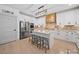 Spacious white kitchen with stainless steel appliances, a center island with seating, and a pantry at 4189 Brandy Creek Ct, Clover, SC 29710