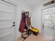Convenient mudroom features coat rack, shoe storage, and easy access to the laundry room at 4189 Brandy Creek Ct, Clover, SC 29710