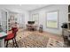 Office space with french doors, hardwood floors, an orange desk, and built-in shelves at 4189 Brandy Creek Ct, Clover, SC 29710