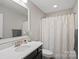 Bathroom with a vanity, framed mirror, and a shower with a curtain at 4195 Island Fox Ln, Denver, NC 28037