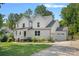 Beautiful white two-story home with a well-kept lawn, a two car garage, and lovely landscaping at 4195 Island Fox Ln, Denver, NC 28037