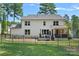 Exterior view of home featuring a large fenced yard and patio area at 4195 Island Fox Ln, Denver, NC 28037